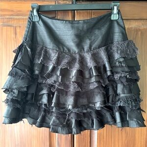 Black deconstructed mini skirt.